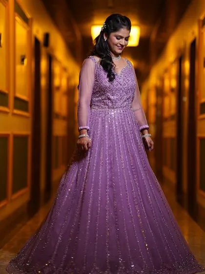 A candid, happy moment. Her makeup looks flawless and radiant as she enjoys her special day.