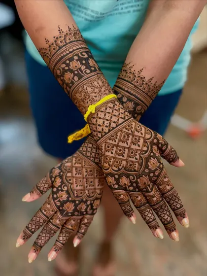 A crossed-arm pose of the same design, highlighting the beautiful jaali work on the palms.