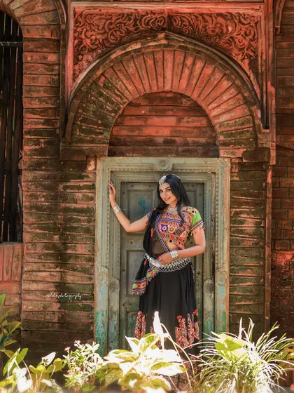 A vibrant and energetic series celebrating Navratri. The model is dressed in colorful Garba attire, and the photos capture the festive spirit through dynamic poses and joyful expressions.