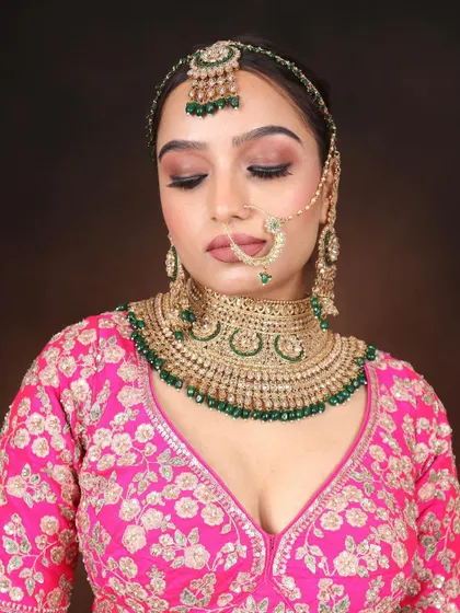 A classic North Indian bridal look taught in our pro makeup course. This features a soft brown smokey eye, a nude lip, and traditional green and gold jewelry.