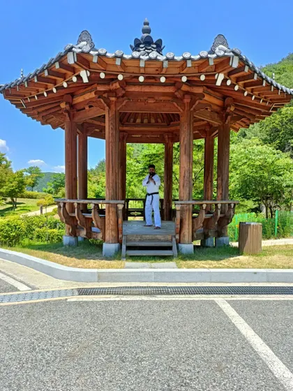 Taking a moment at a traditional Korean pagoda in Muju.