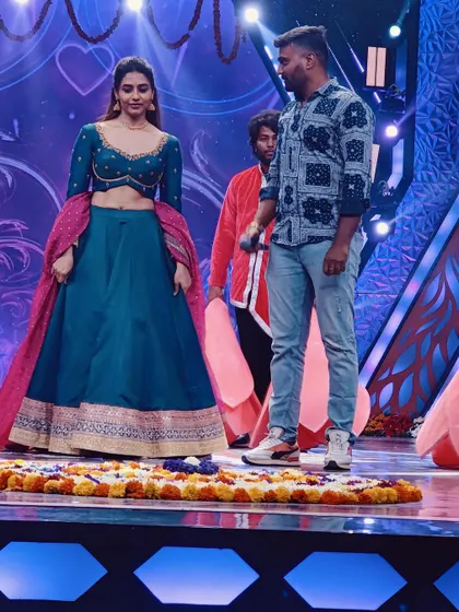 A candid shot while choreographing for Sapthami Gowda on the 'Ugadi Utsava' stage.