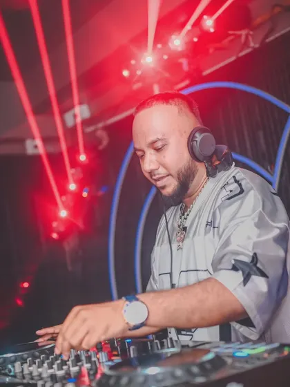 Another shot of me working the turntables under the red lights. The atmosphere has to be right to get people in the zone for some classic hip hop.