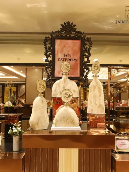 Attention to detail is key. This image shows a beautifully arranged dessert and appetizer station with unique, artistic serving pieces.
