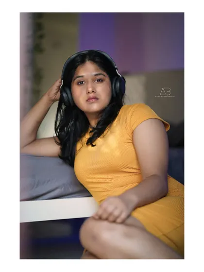 A fun and relaxed shot from the same series, adding headphones to create a different character and story.