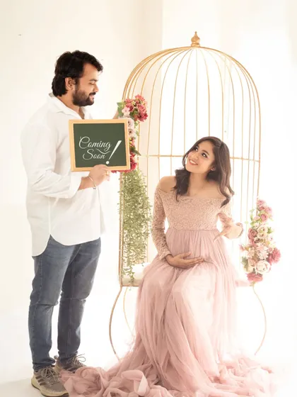 A fun and sweet "Coming Soon" announcement. We love capturing the playful and happy moments between couples as they anticipate their new arrival.