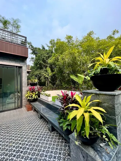 It’s so much fun when birds and butterflies are right outside your bedroom. This second floor garden provides beauty, privacy, and a lovely view, allowing the large picture windows to be kept open.