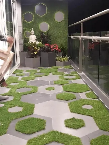 For this balcony makeover, I used a creative combination of hexagonal tiles and artificial grass patches. It’s a modern, playful design that adds texture and greenery while being easy to maintain.