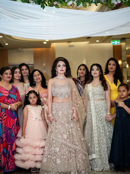 A lovely group photo of the bride with her family and friends, a cherished memory from the engagement day.