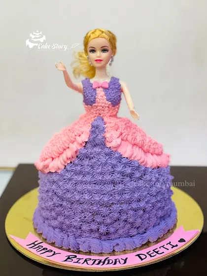 The classic Barbie doll cake is always a favorite. For this design, I created a beautiful gown for Barbie using pink and purple buttercream piping, making it a dream cake for any fan.