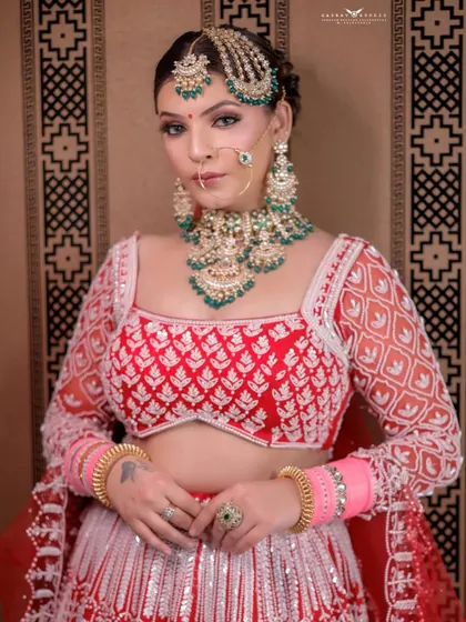 A poised and elegant portrait. The bride's hands are gently clasped, and her expression is serene, creating a timeless and classic bridal photo.