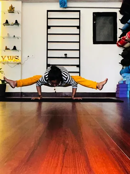 A moment of yoga love, holding a firefly pose in the studio. The wooden floor and the energy of the space make every practice special.