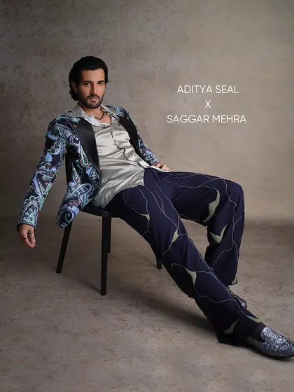 For Aditya Seal's feature in FHM India, I created this printed tuxedo to merge semi-formal sophistication with a relaxed charm. The look features a vibrant paisley print, a satin lapel, and uniquely patterned trousers, showcasing a bold approach to modern tailoring.