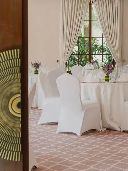 A close-up of the custom brass-inlaid door handle leading into the banquet hall. This small but significant detail exemplifies the commitment to refined craftsmanship and thoughtful design that elevates the entire space.