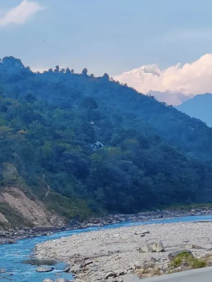 The view from the road on our way to Chopta, with the Alaknanda river below and the first peek of snow-covered Himalayan peaks in the distance.