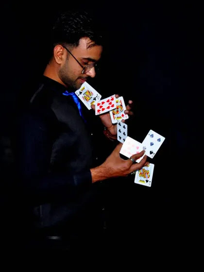 A cascade of cards frozen in motion. This is the art of card manipulation, a visually stunning skill I bring to my performances.