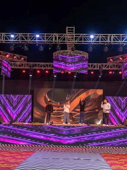 The same Sangeet stage with different lighting and visuals, showcasing the dynamic and versatile nature of the technical production I manage for events.