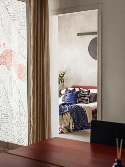 Peeking from one space into another in the 'Rustic Minimal' apartment. We design layouts that create interesting sightlines and a sense of discovery as you move through the home.