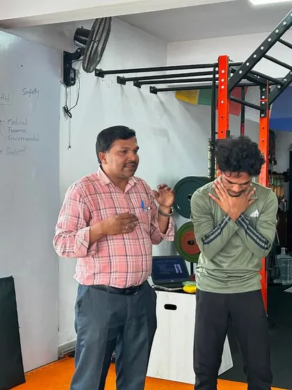 An instructor demonstrating the proper technique for assisting someone who is choking.
