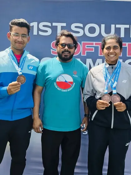 Two of my medal-winning players at the South Asian Championship. We train both male and female athletes to become top competitors.
