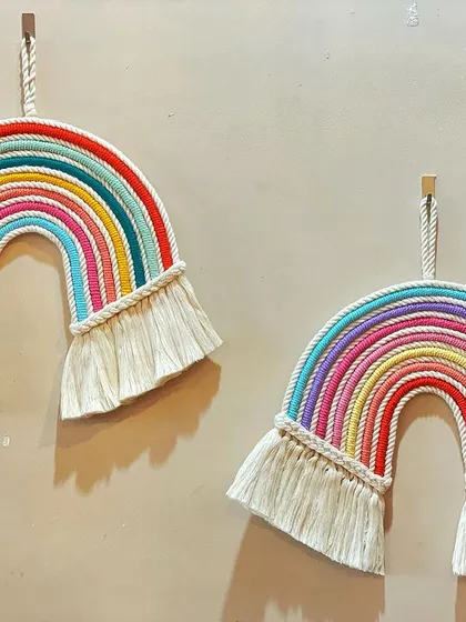 Nothing brings a smile like a rainbow. I make these chunky macrame rainbows in various sizes and color combinations to add a splash of cheer to a child's room or any happy space.