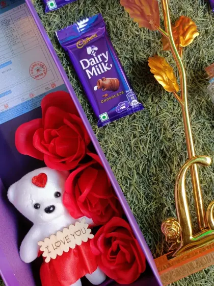 The combo also includes a cute 'I love you' teddy bear nestled with roses. It's all about the small, thoughtful details.
