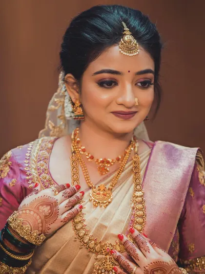 A close-up on the details, from the soft eye makeup to the beautiful henna designs on her hands.