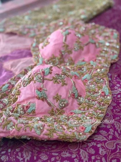 The front of the pink bird motif blouse.