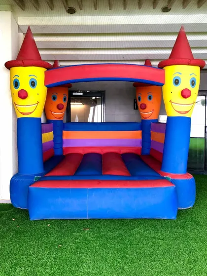 The classic Clown Bouncy is a cheerful and colorful addition to any kids' party. This standard-sized bouncer fits well in backyards or on artificial turf for simple, jumping fun.