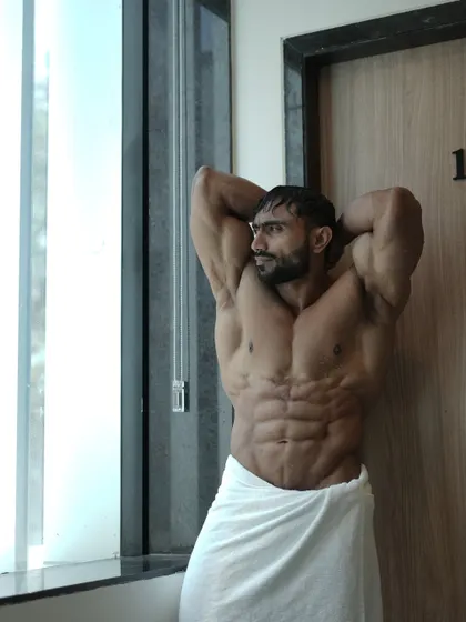 Romantic song. A moody shot in a towel, showing my abs and chest.