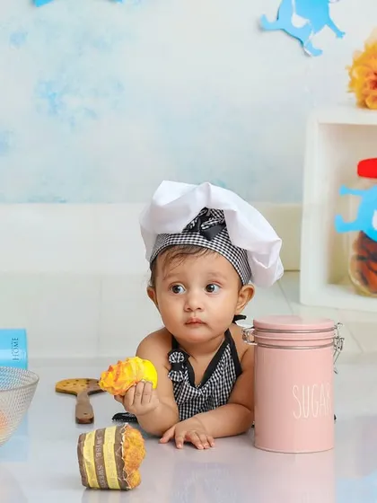 Caught mid-snack. This adorable chef couldn't resist a little taste test while cooking up some fun in the studio kitchen.