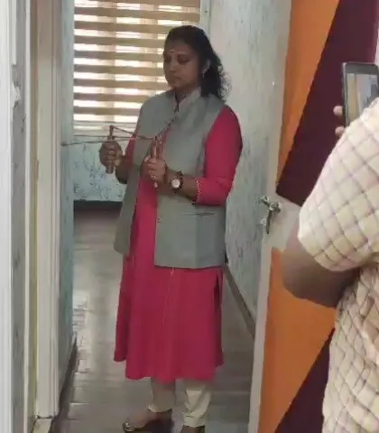 Here, I am using dowsing rods to check the energy flow in a client's space. This is a crucial first step in my process, allowing me to scientifically identify areas of negative energy or geopathic stress before recommending a precise Vastu or energy correction.