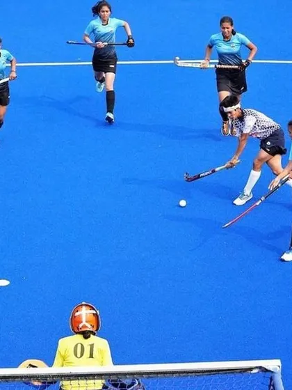 A high-intensity attacking drill on the blue AstroTurf. My players practice offensive movements to break down defenses and create scoring opportunities.