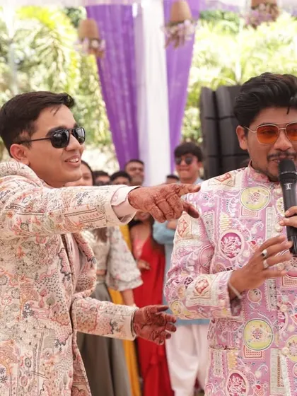 Interacting with the groom during a colorful Haldi ceremony. The vibrant decor and happy faces make these daytime events so special to host.