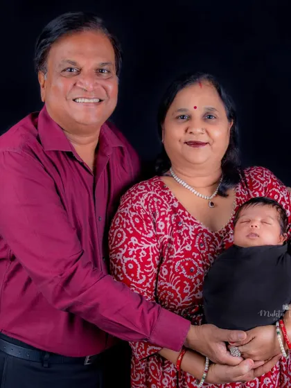 Grandparents' joy. Including the whole family in newborn photos creates a beautiful record of this special time.