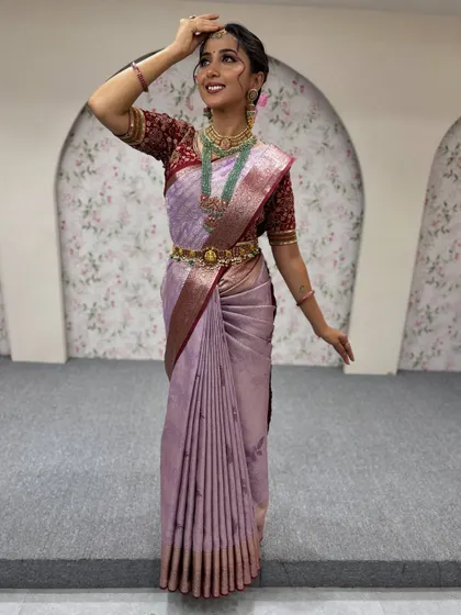 This pose captures the beautiful fall of the saree and the intricate details of the jewellery and hairstyle, all part of our complete makeover service.