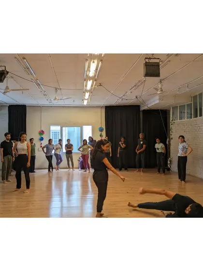 A wide shot of the studio during an X-Sense class, showing students practicing different elements of a choreography.