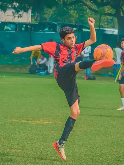 An athletic leap to control the ball mid-air.