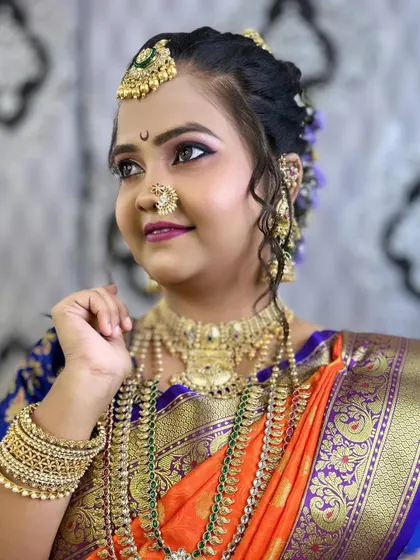 Another angle of the model, showing the intricate details of the jewellery and the 'chandrakor' bindi.