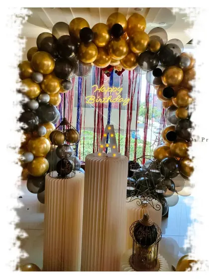 Another view of the gold and black themed birthday setup.