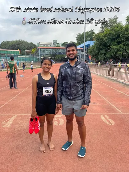 A silver medal finish in the 400m for our Under-16 girls' athlete at the State Level School Olympics, pictured here with her coach.
