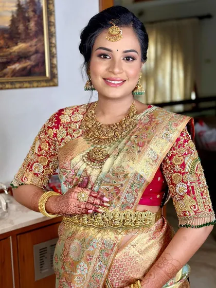The client cradles her baby bump, looking serene and beautiful.