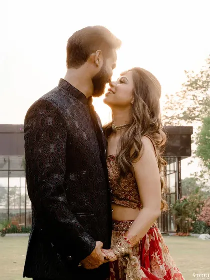 A classic romantic pose against the setting sun. The soft light and close embrace create a beautifully warm and intimate pre-wedding portrait.