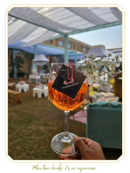 A guest enjoying a refreshing Aperol Spritz from our Bubbly Bar. This concept is always a hit at daytime events, offering a light and stylish drink option.
