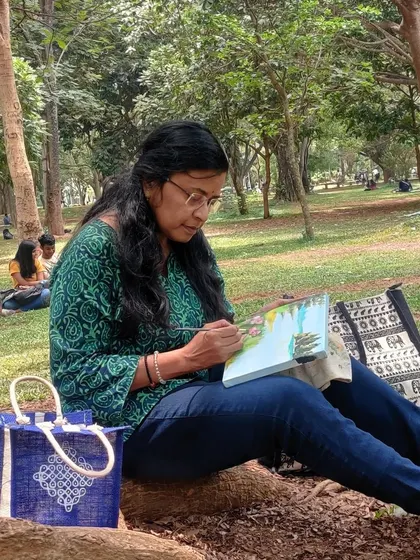Another shot of me painting in the park, absorbed in my work.