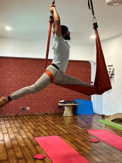 An impressive aerial split, demonstrating the incredible flexibility and strength that can be developed through this practice.