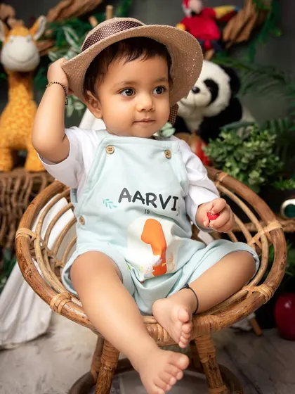 Ready for an adventure. This jungle-themed first birthday setup, complete with a personalized outfit, is a fun and creative way to celebrate the big one.