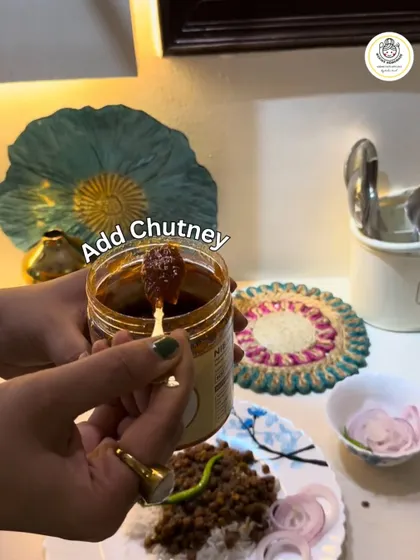 A simple way to add a dash of zest to your life. Here, a spoonful of my chutney is being added to a plate of rajma chawal, instantly changing the meal.