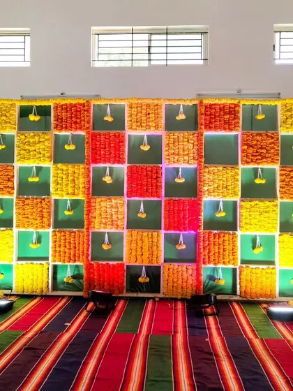 Another view of the ear piercing ceremony backdrop.