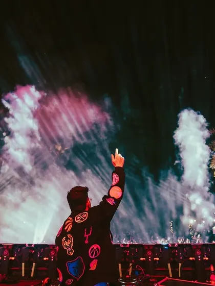 Another angle of the pyro show, creating a wall of light and energy that the crowd feels.